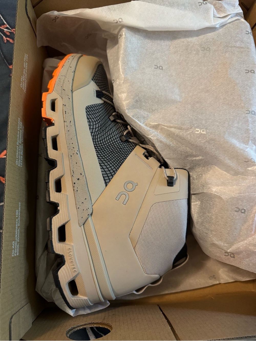 On Running Cloudrock Mid-Top Hiking Boot in Sand with Orange Accent